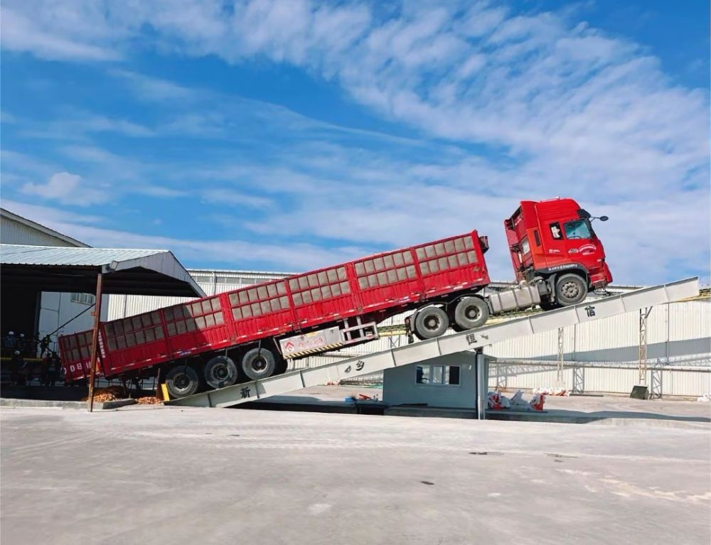 液壓卸車機(jī)、后翻式液壓翻板卸車平臺、河南愛信液壓翻板機(jī)